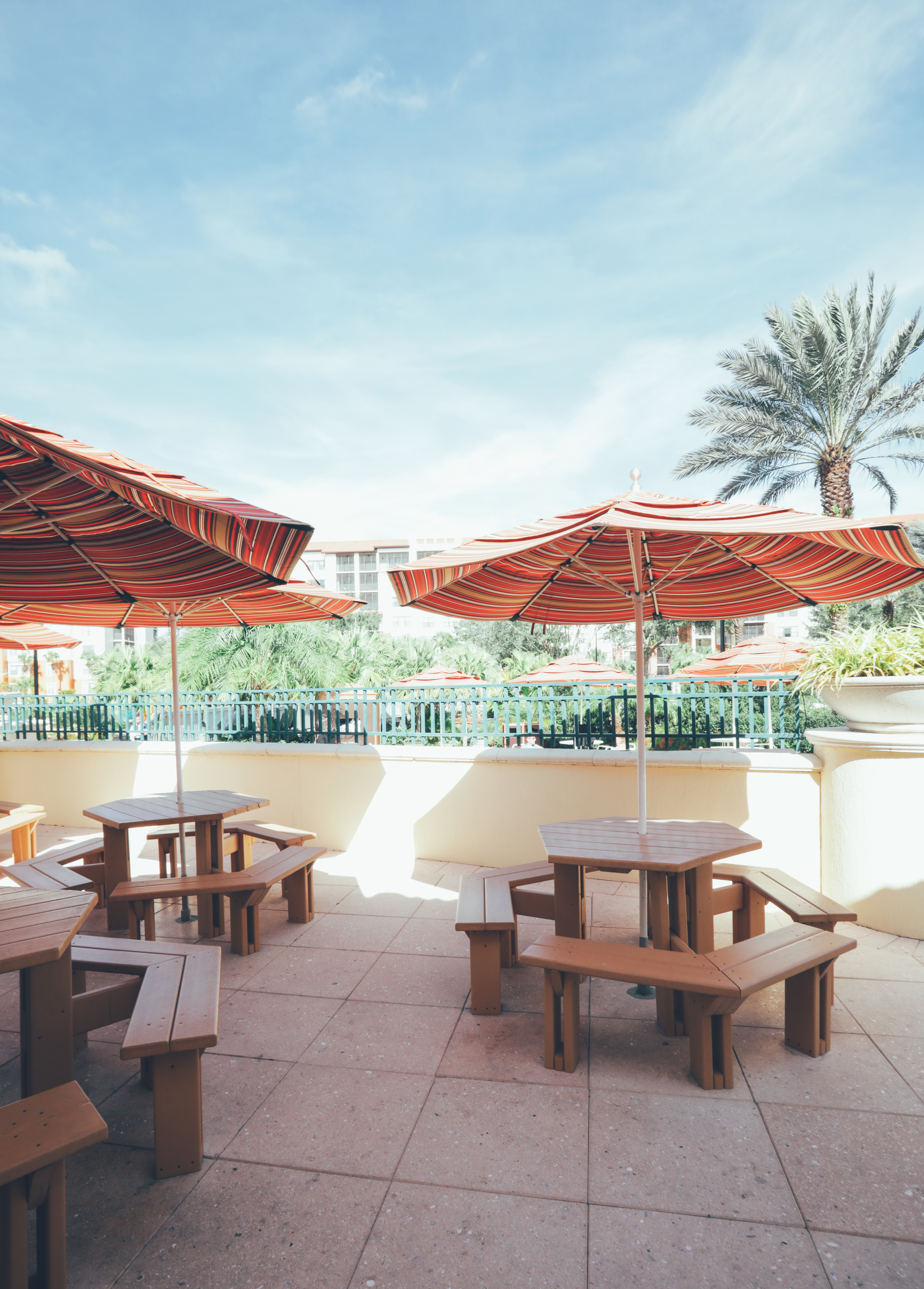 Outdoor seating with umbrellas in River Island at Orange Lake Resort near Orlando, Florida.