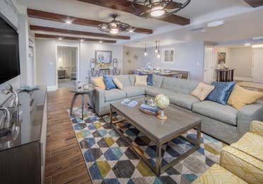 A living room in a four-bedroom Signature Collection villa at Cape Canaveral Resort.