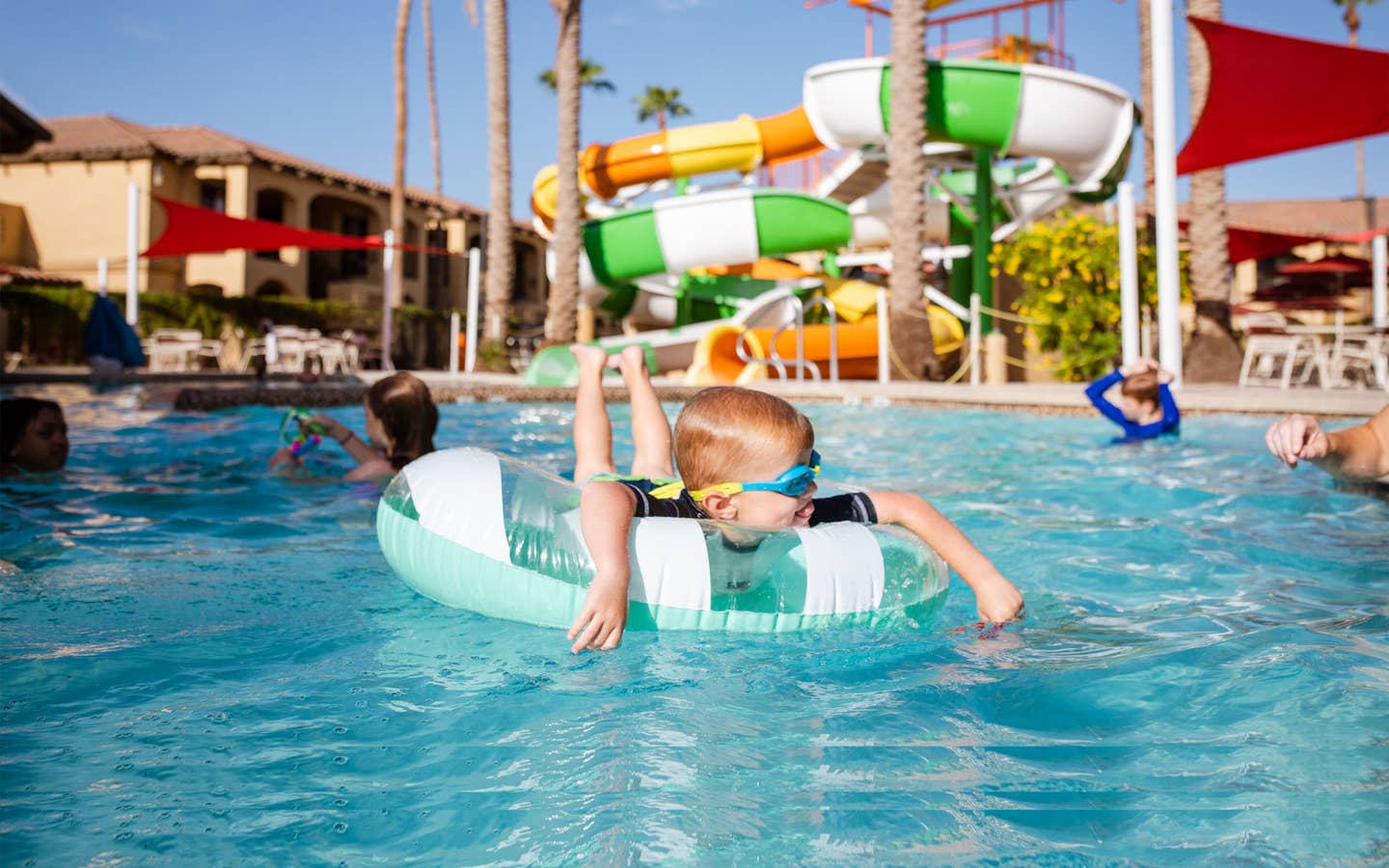 Young child floating in pool at Scottsdale Resort.