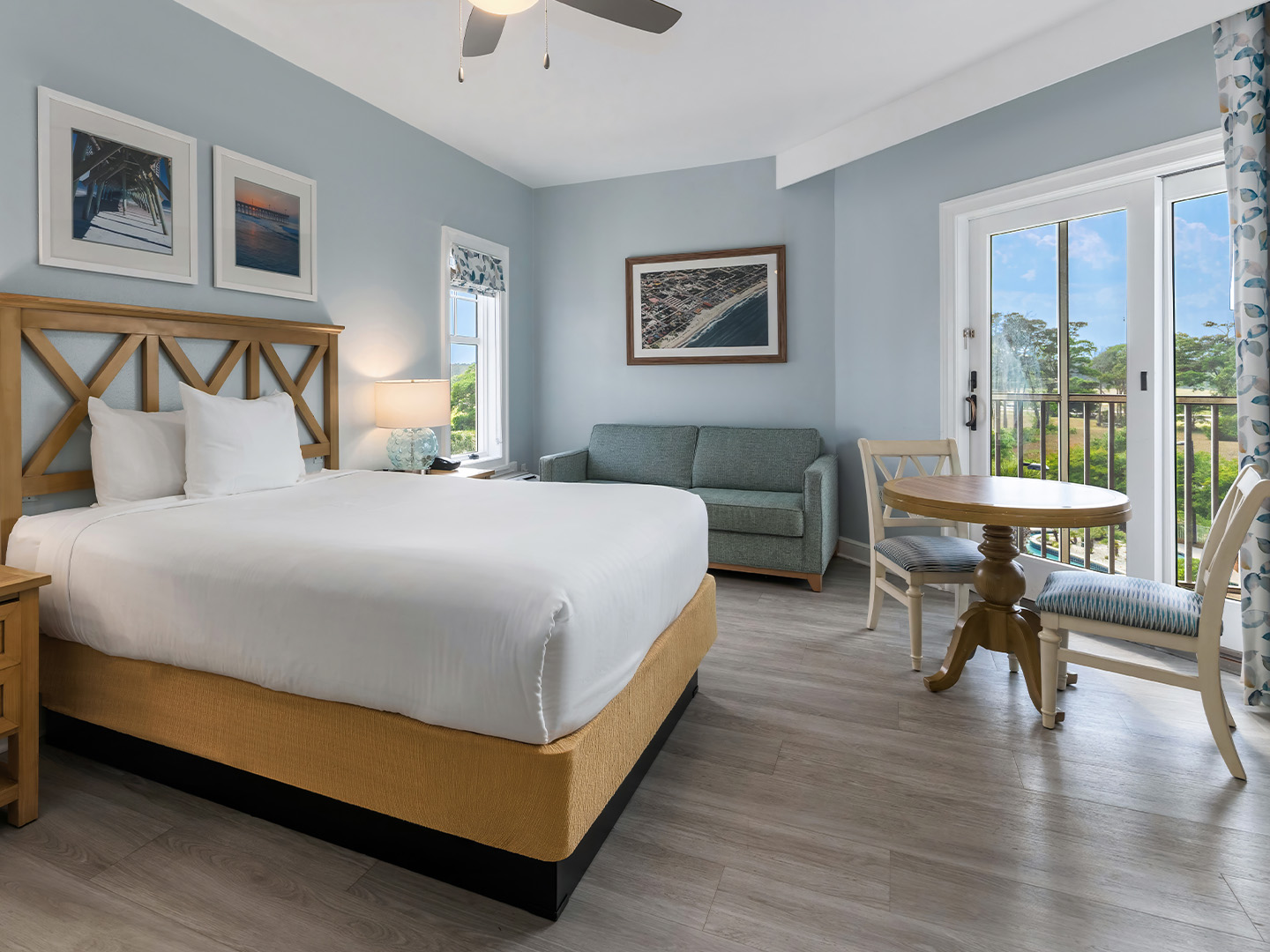 Studio room with a bed, couch and sitting area at South Beach Resort in Myrtle Beach, South Carolina.