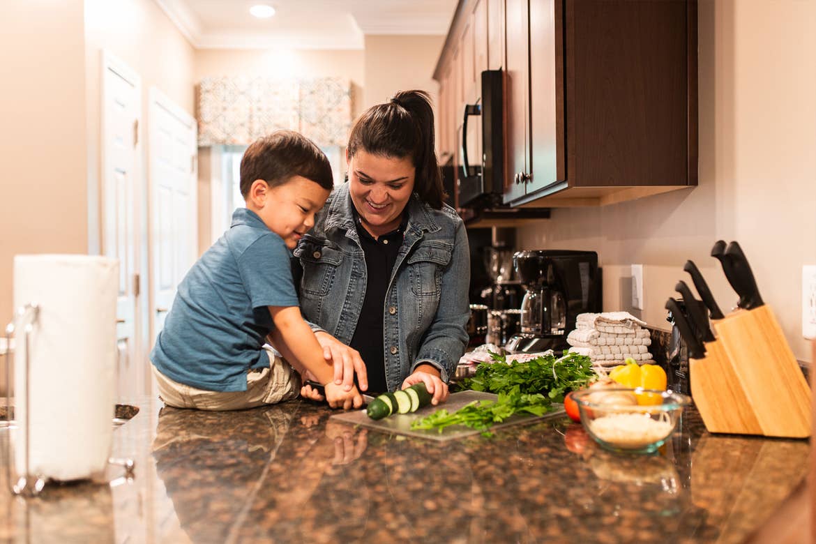 Featured Contributor, Angelica Kajiwara (right), and her son prep food in the villa kitchen of our Williamsburg resort in Williamsburg, Virginia.