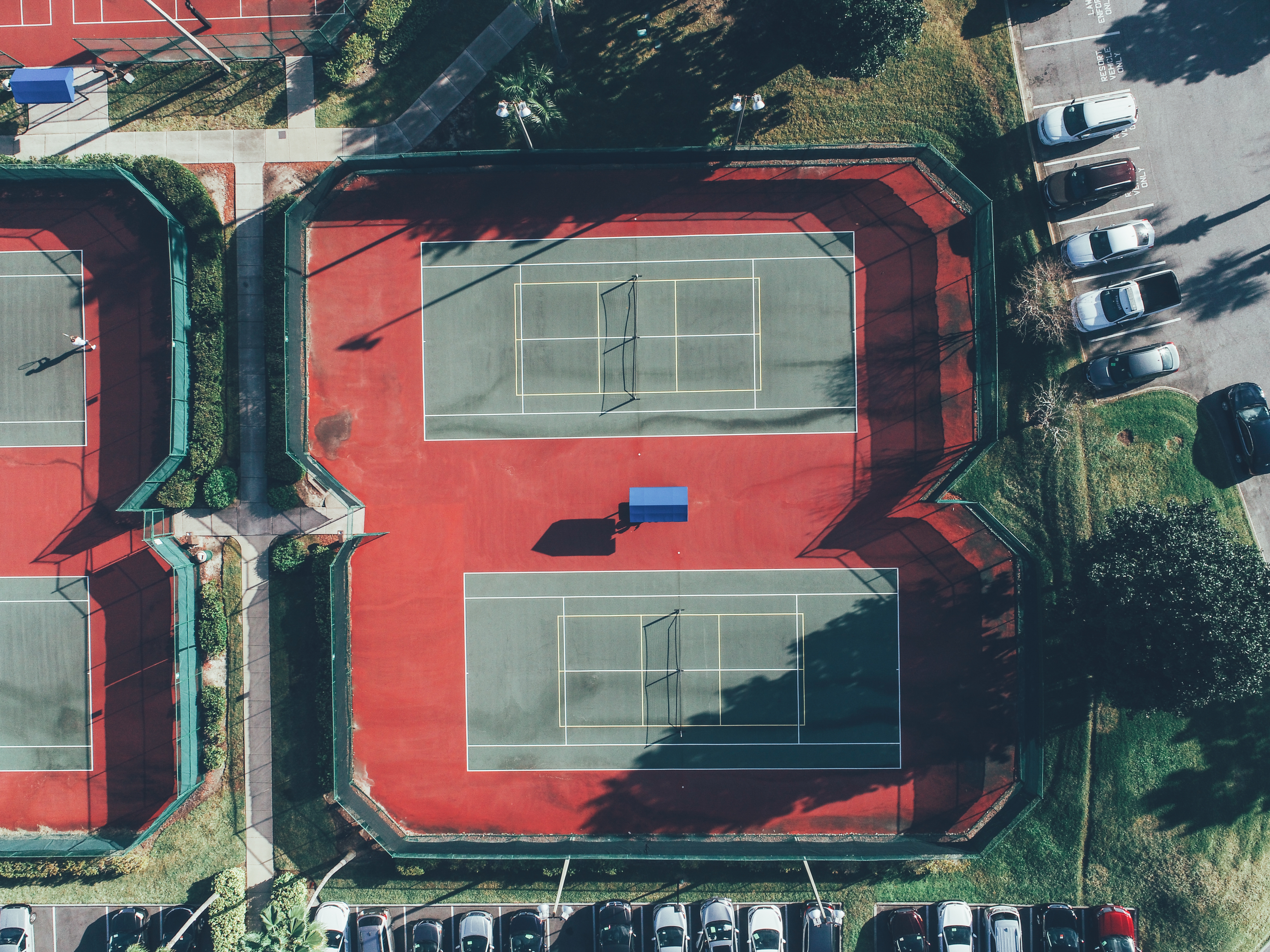 Aerial view of outdoor tennis courts in West Village at Orange Lake Resort near Orlando, Florida.