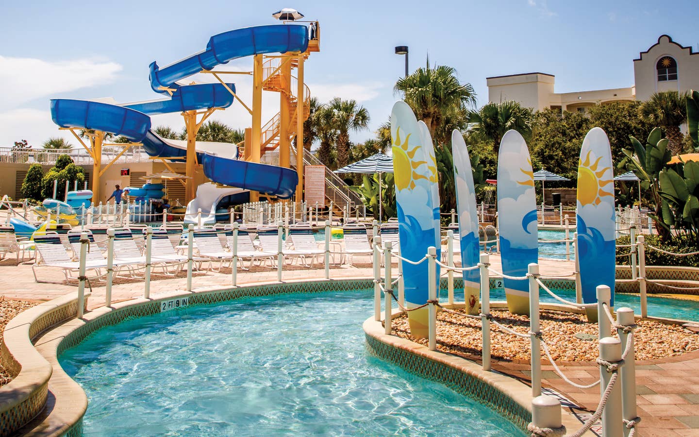 Lazy river with waterslide in background at Cape Canaveral Beach Resort.