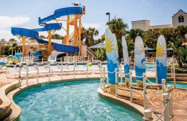 Lazy river with waterslide in background at Cape Canaveral Beach Resort.