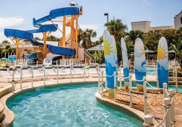 Lazy river with waterslide in background at Cape Canaveral Beach Resort.