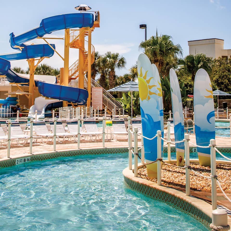 Lazy river with waterslide in background at Cape Canaveral Beach Resort.
