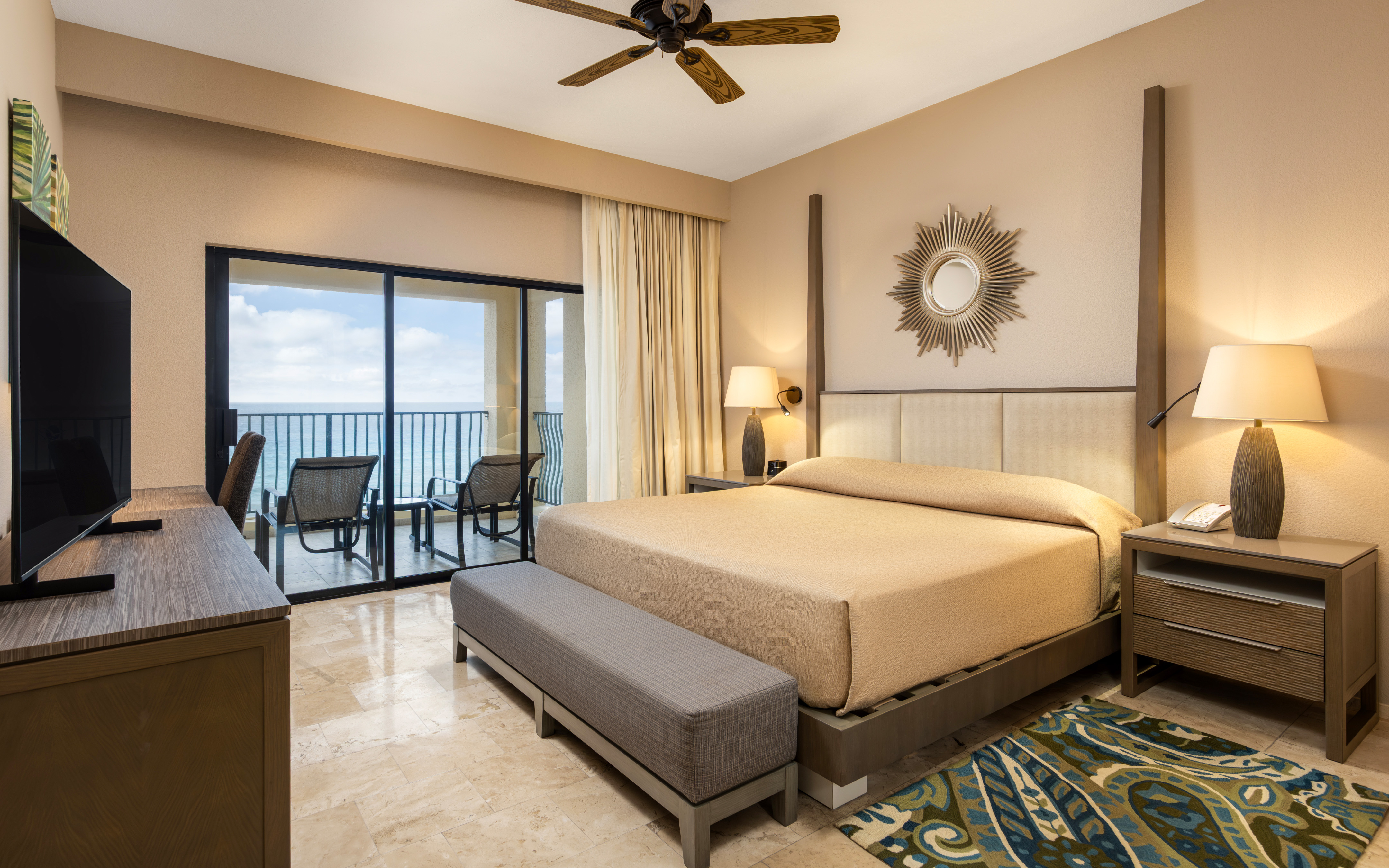 Peaceful master bedroom with ocean views and modern décor.