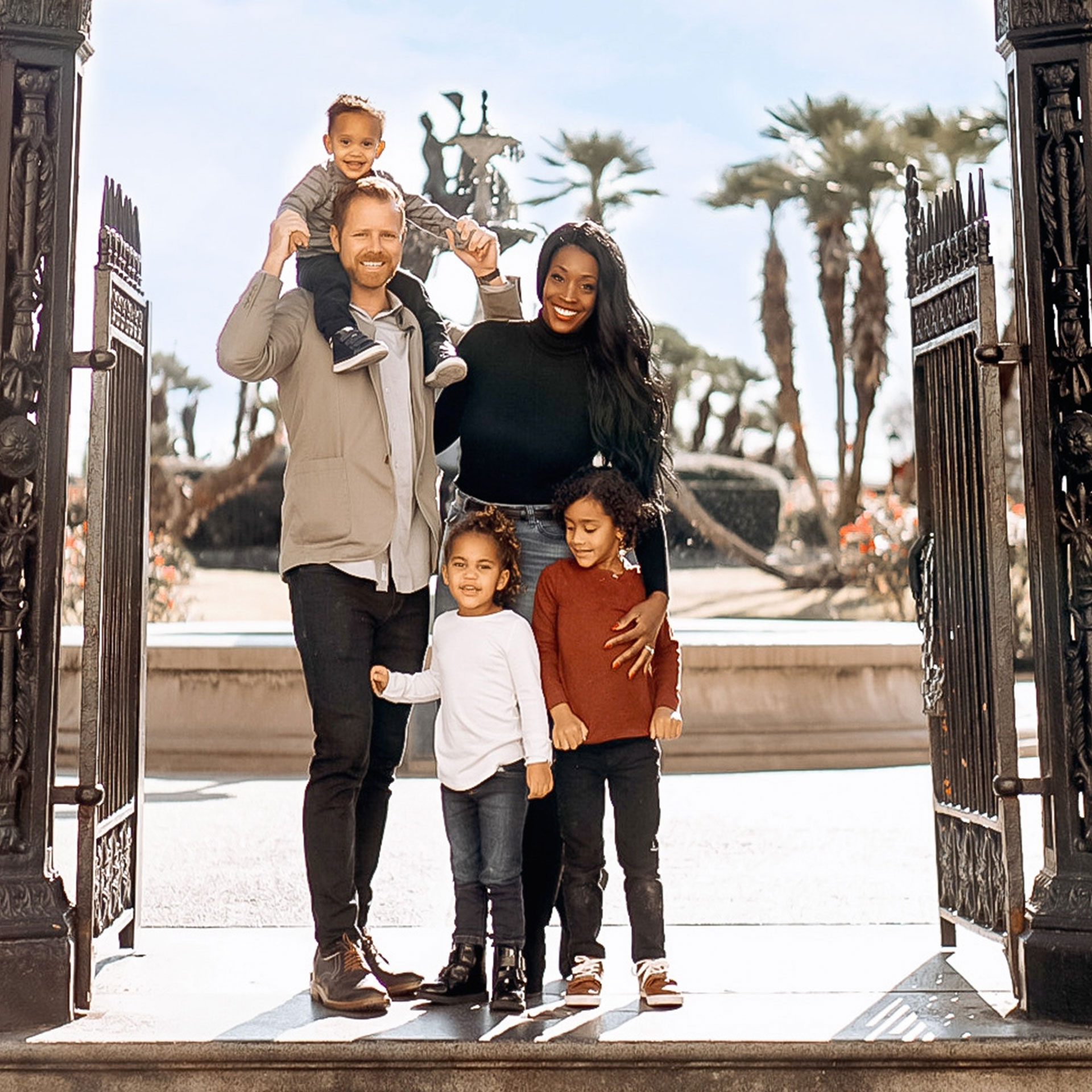 Featured Contributor, Sally Butan of @butanclan (top-right) stands with her husband, Kevin (top-left), and their children pose in Jackson Square of New Orleans, Louisiana.