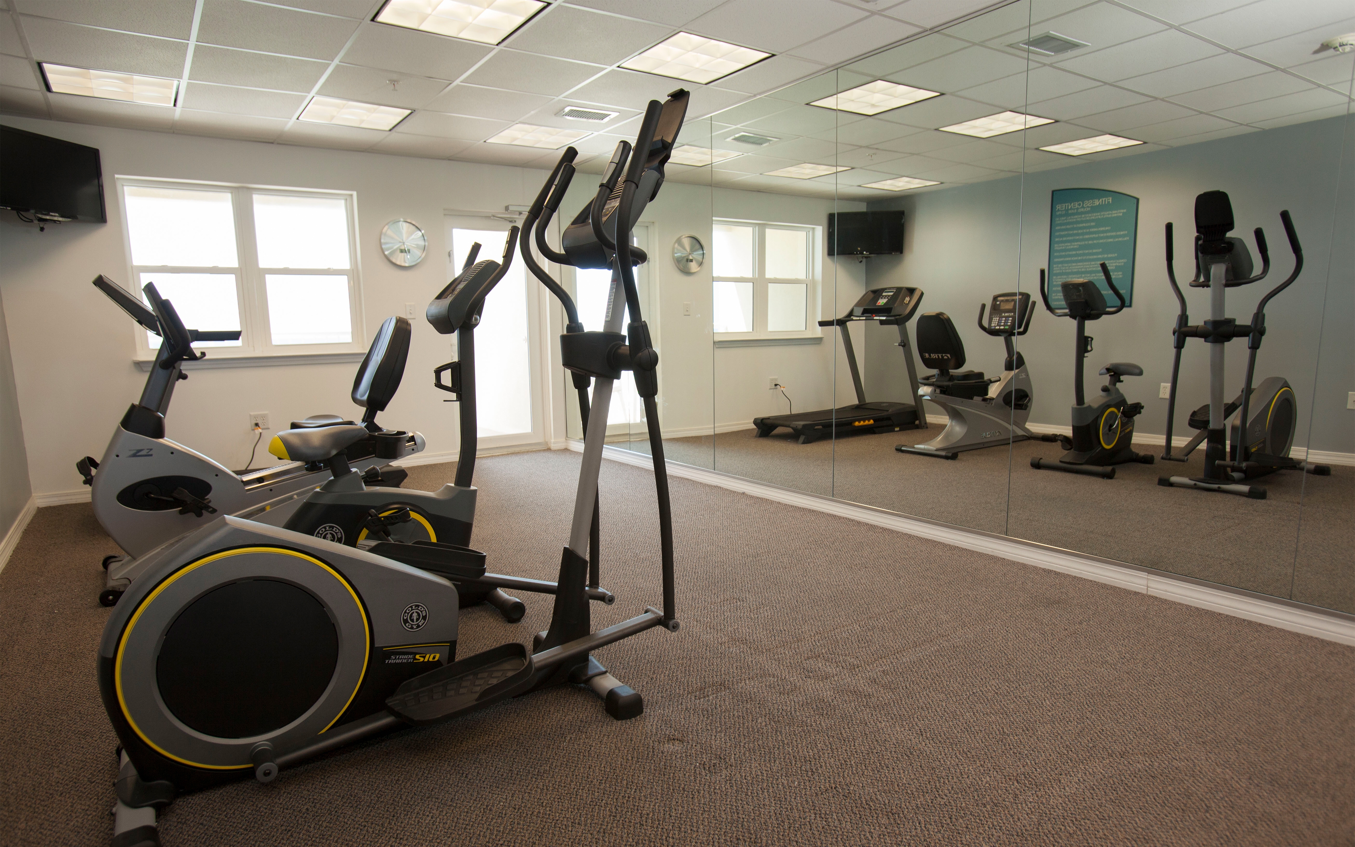 Fitness center with treadmills, stationary bicycles and ellipticals at Panama City Beach Resort in Florida.