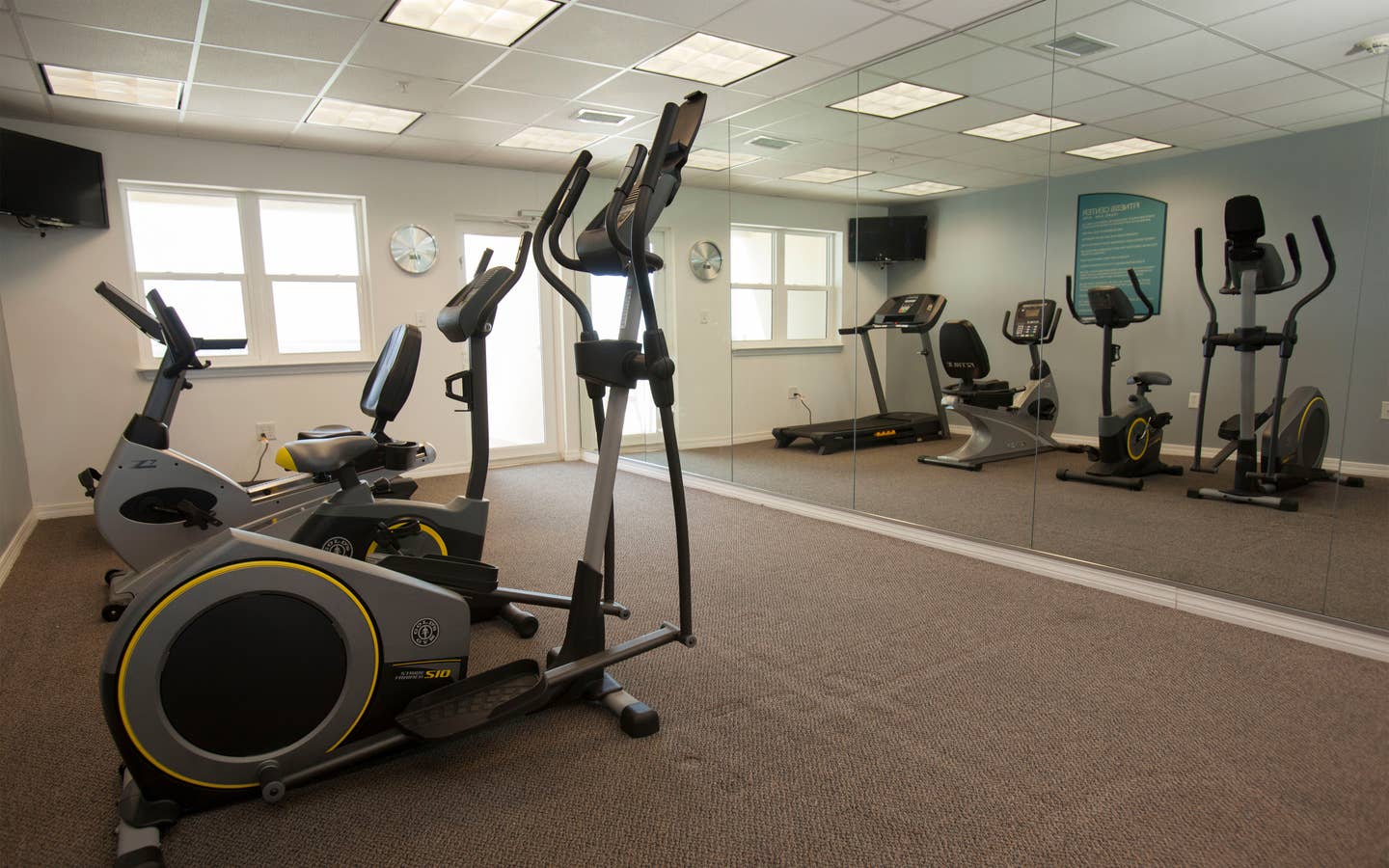 Fitness center with treadmills, stationary bicycles and ellipticals at Panama City Beach Resort in Florida.