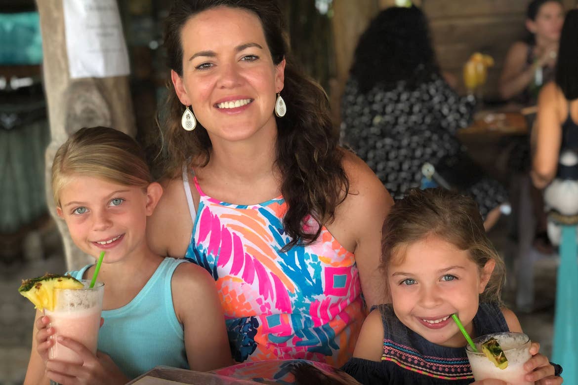 Featured Contributor, Chris Johnston's two daughters, Kyler (right) and Kyndall (left), drink virgin Pina Coladas with family friend and Checking In Editor-in-Chief, Jenn C. Harmon (middle).