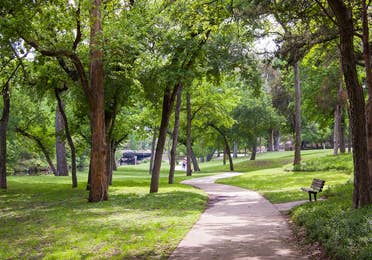 Pathway along with trees at Bergfeld Park near Villages Resort in Flint, Texas.