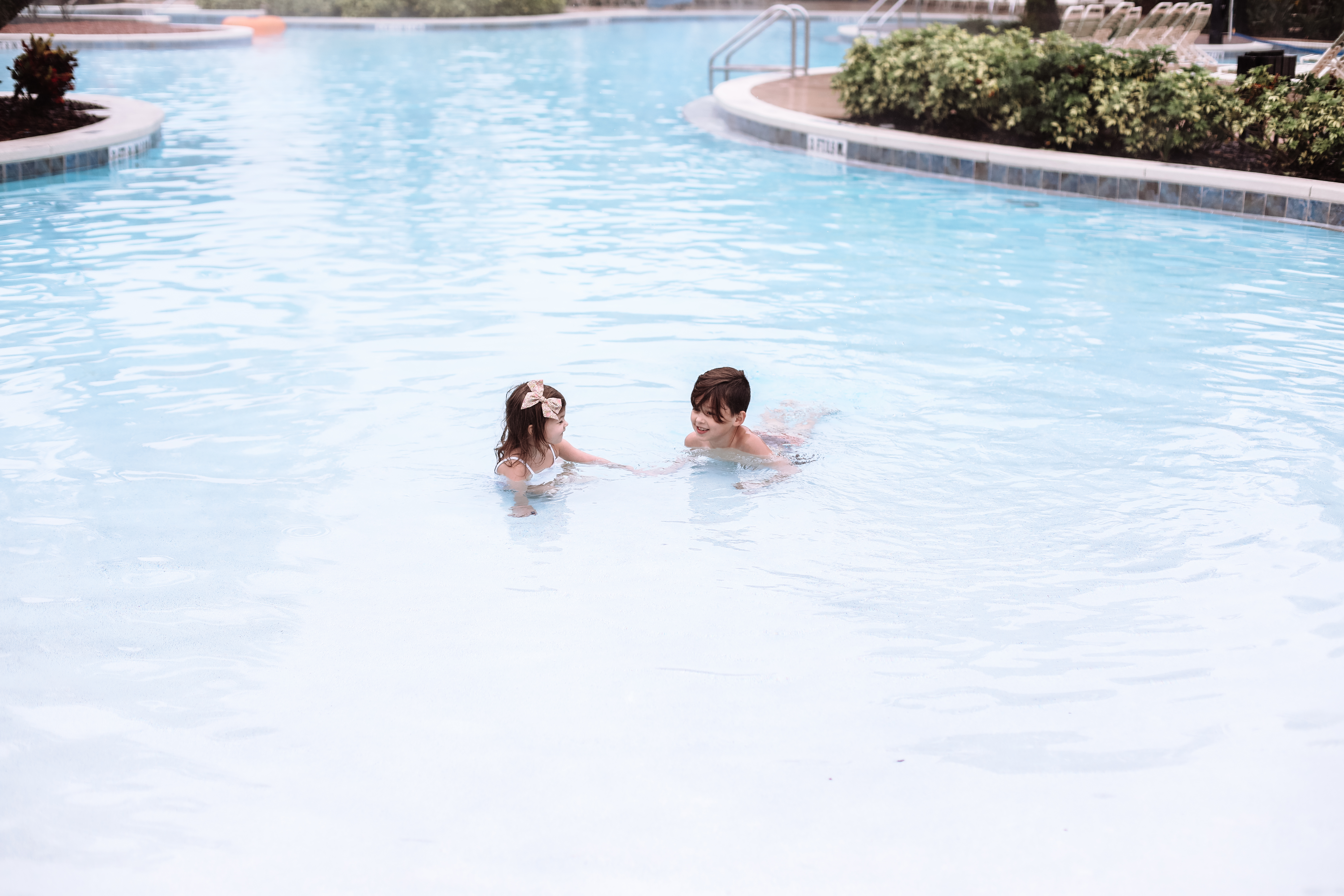 Mia's kids playing in the pool