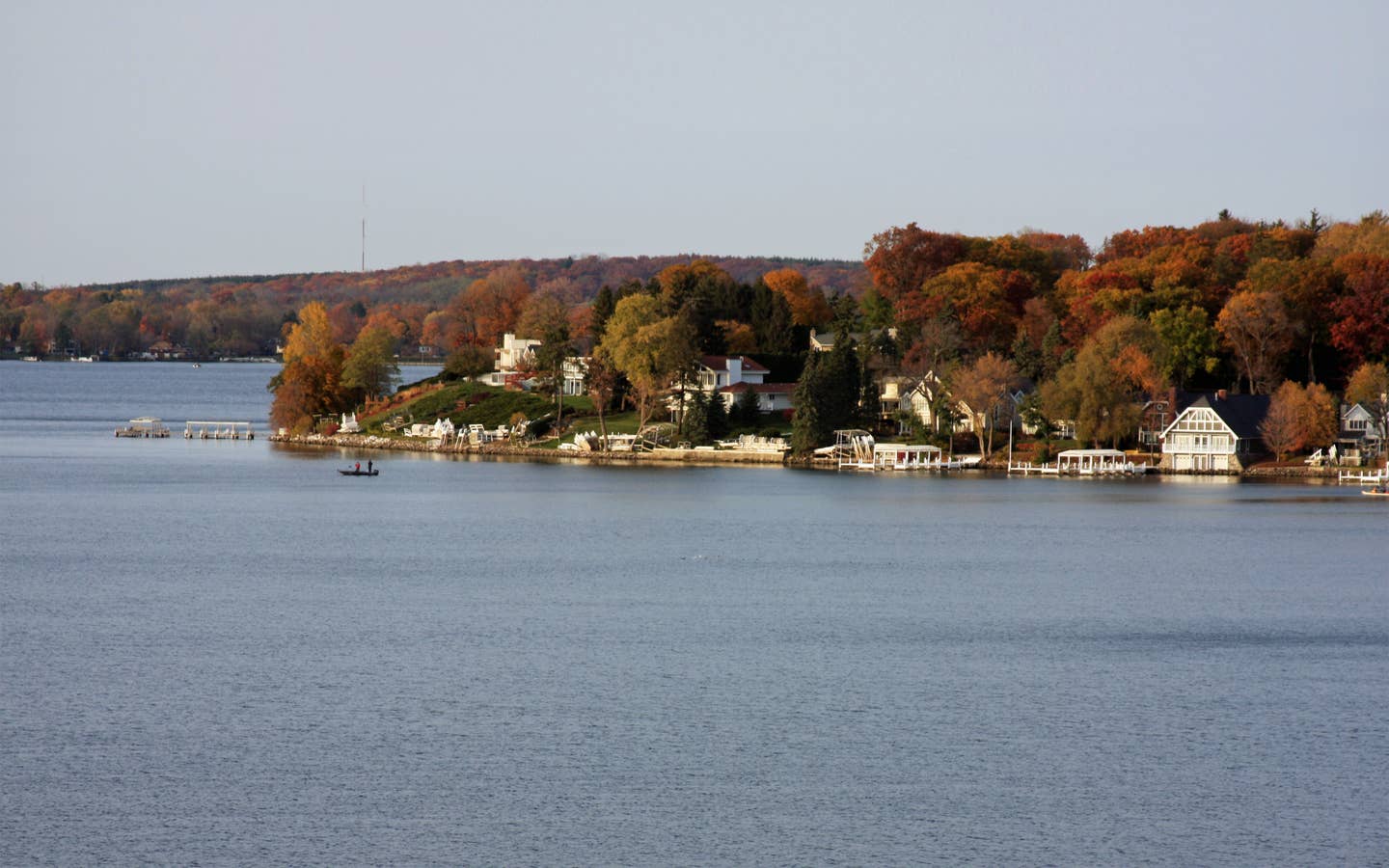 View of trees on edge of lake in Lake Geneva, Wisconsin.