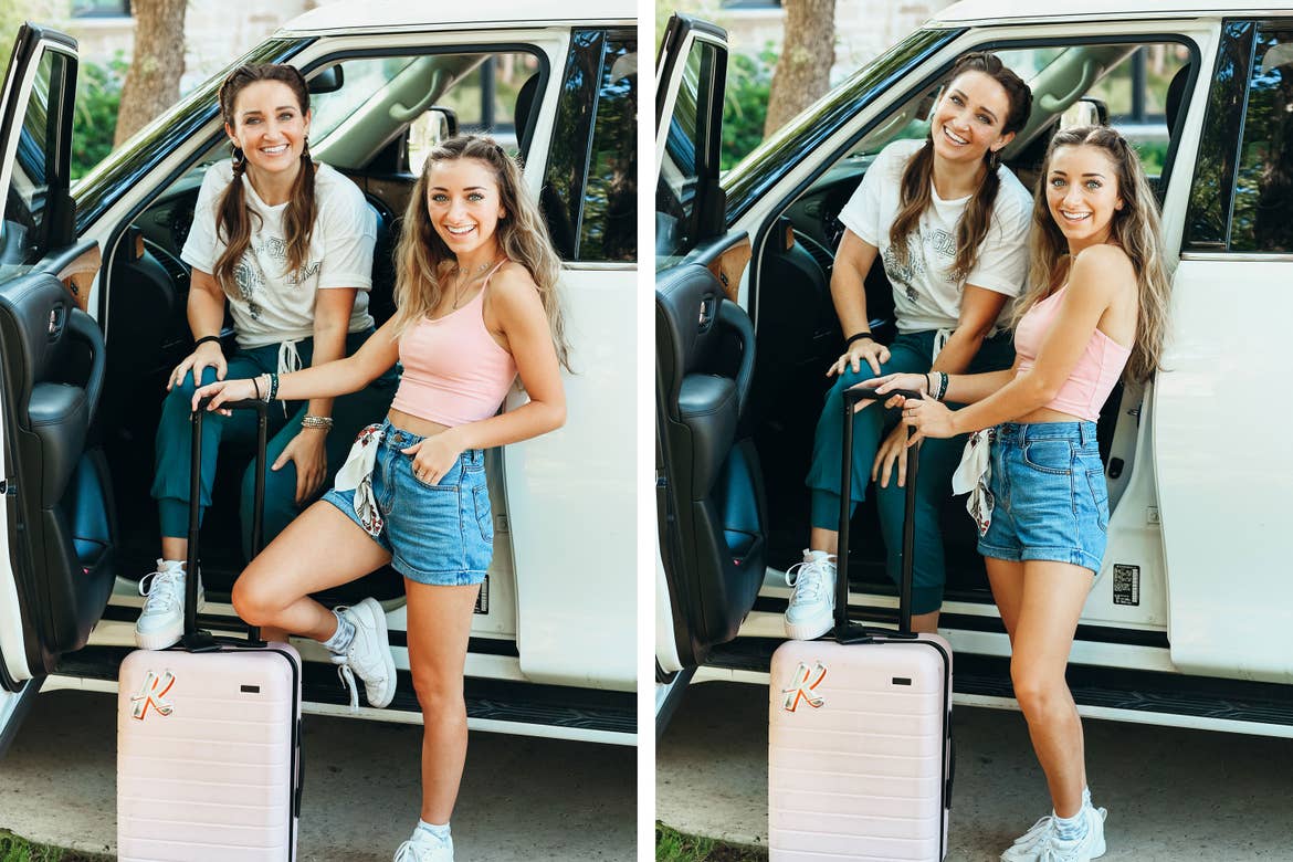 Mindy and her daughter pose in front of their SUV with along with a pink suitcase with hair essentials in tow.