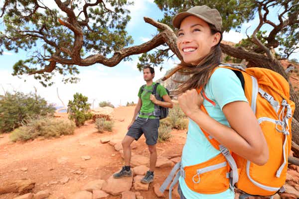 Two people hiking in a desert area