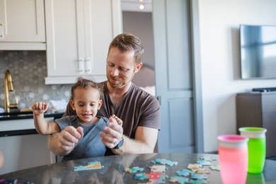 Featured Contributor, Sally Butan of @butanclan's husband, Kevin (right) and her son (left) enjoy puzzles in our Signature Collection villa at our resort in New Orleans, Louisiana.