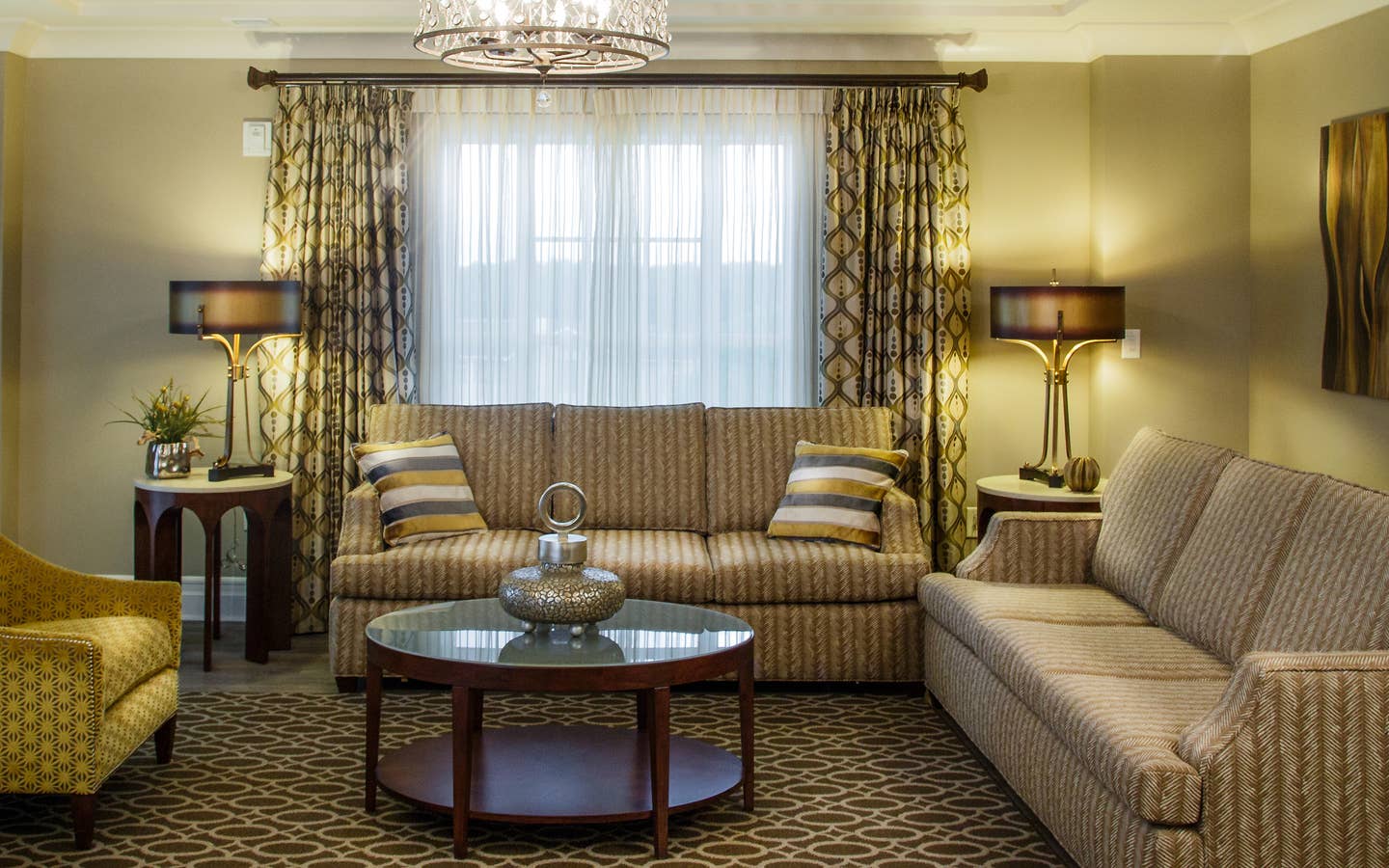 Living room with two couches and a chair in a three-bedroom Signature Collection villa at South Beach Resort in Myrtle Beach, South Carolina.