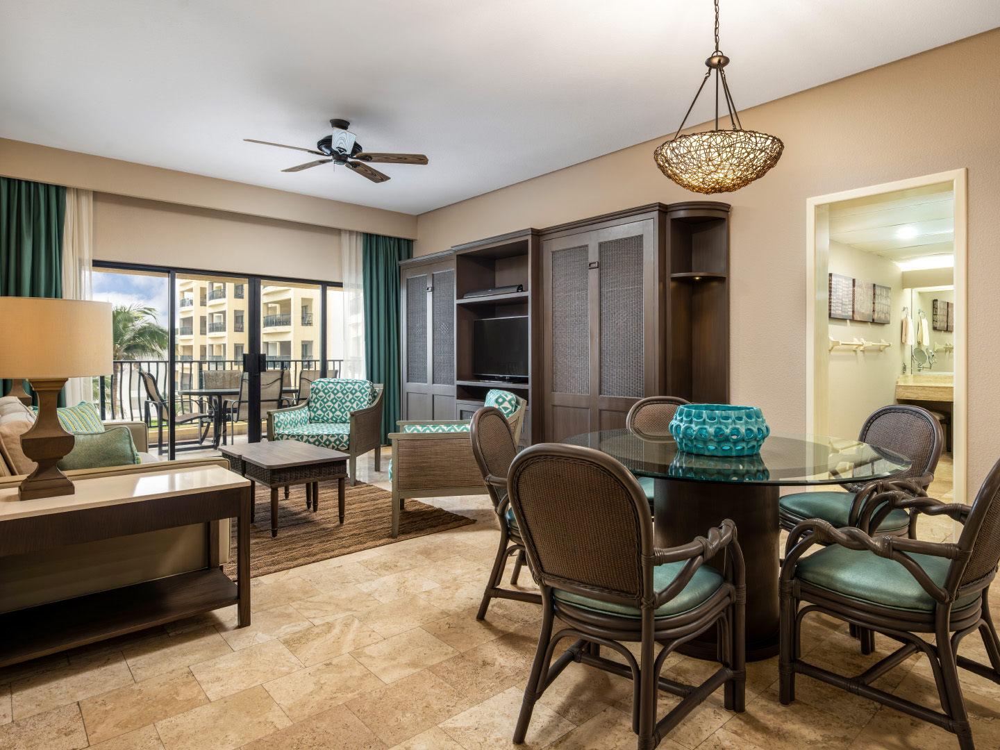 Bright oceanview living room with a dining area and balcony.