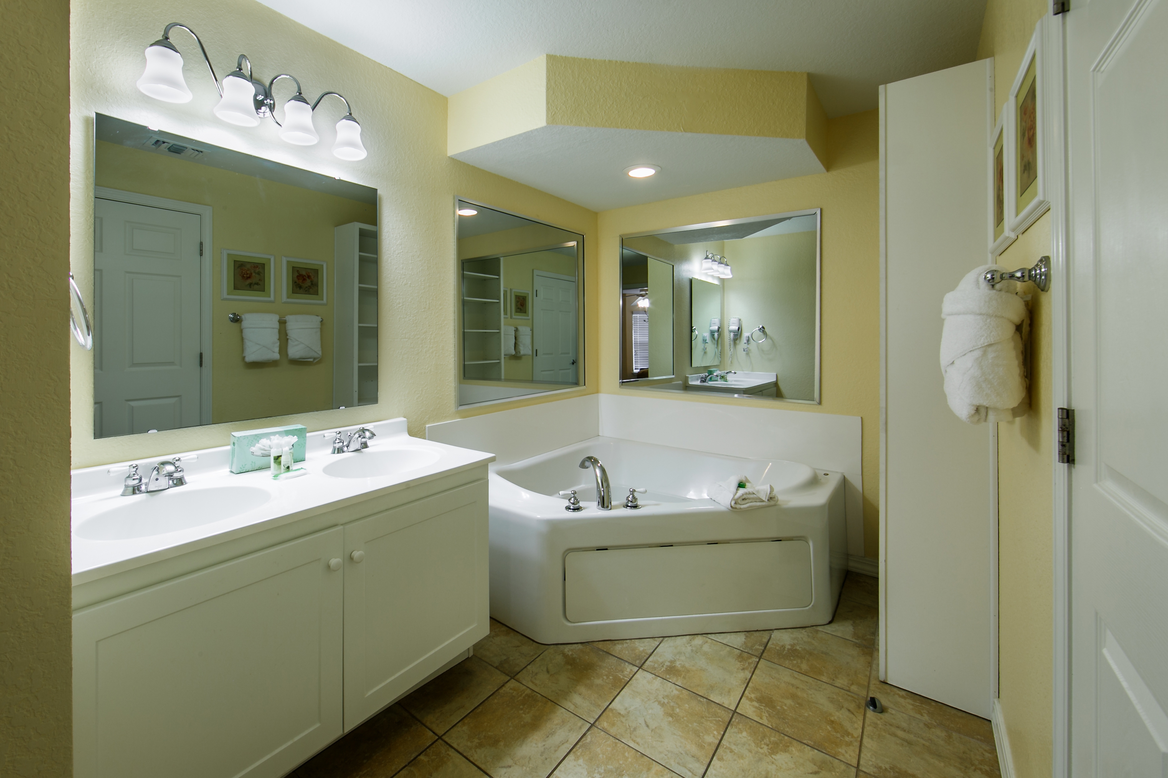 Bathroom with tub in a villa at Orlando Breeze Resort.
