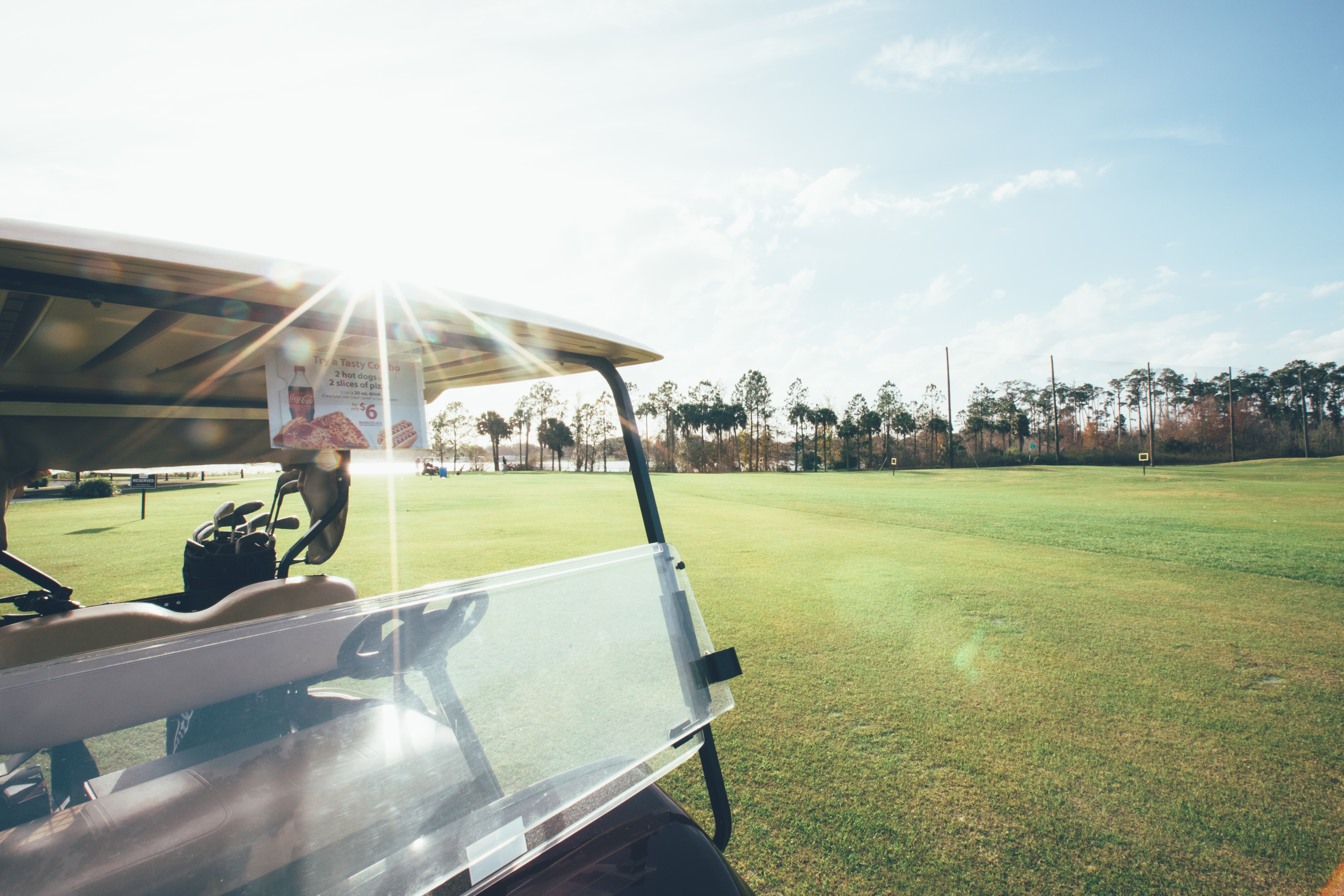 Golf cart driving on golf course in West Village at Orange Lake Resort near Orlando, Florida