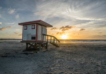 Sunset view of the beach at Jetty Park at Holiday Inn Club Cape Canaveral Resort in Cape Canaveral, FL