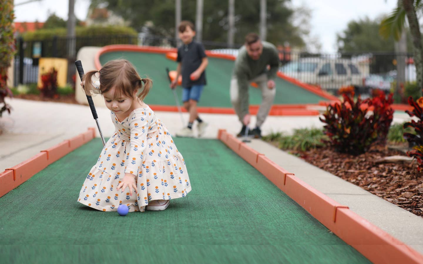 Young child playing mini golf at Orange Lake Resort near Orlando, Florida.