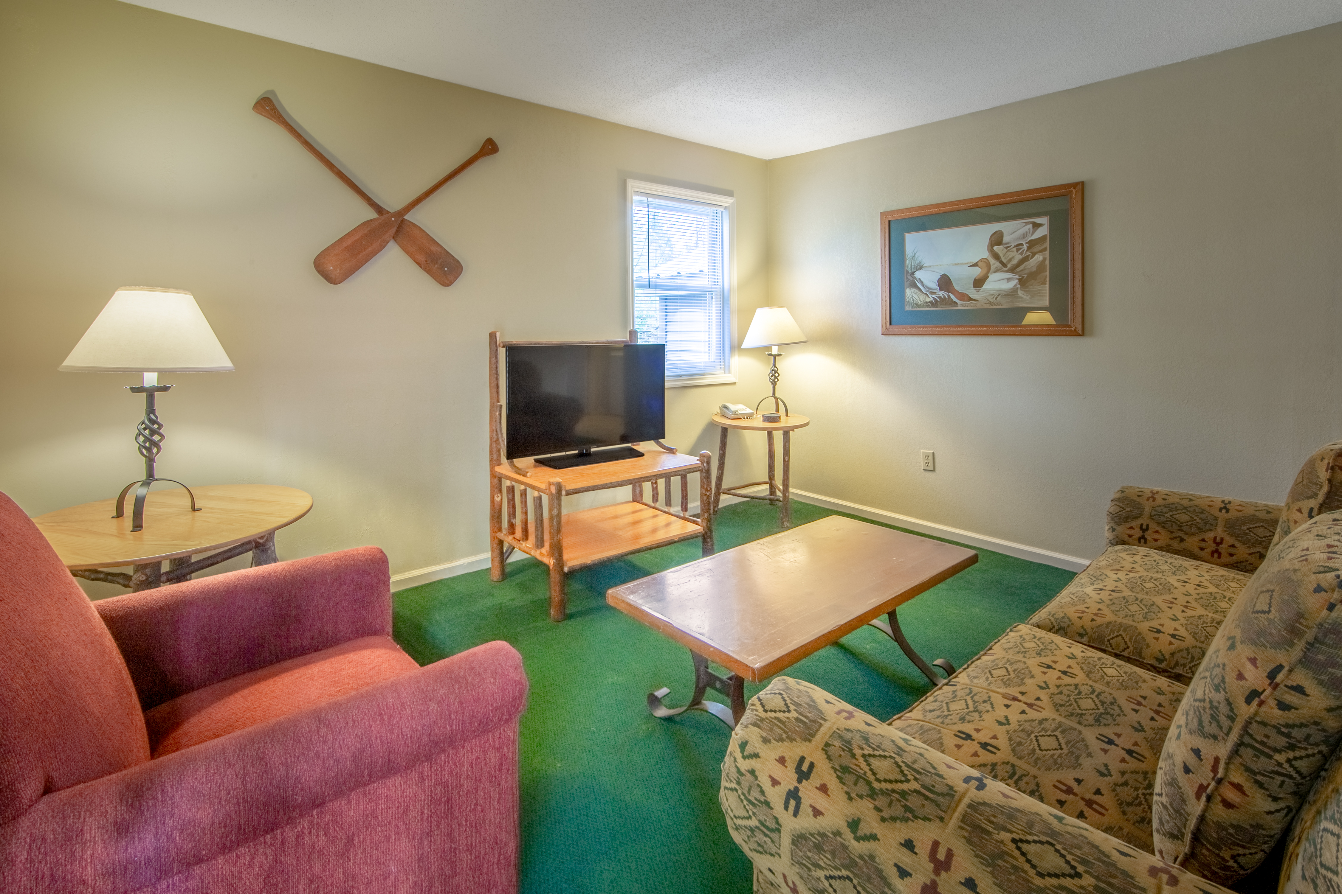 Living room in a Suite at Oak n' Spruce Resort in South Lee, Massachusetts