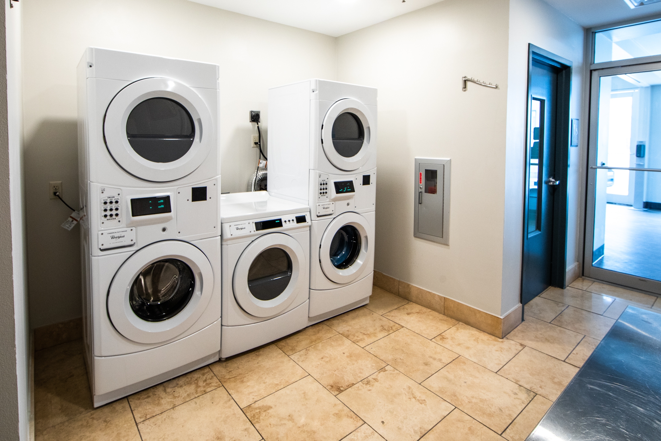 Washer/dryer area with five machines at New Orleans Resort in Louisiana.