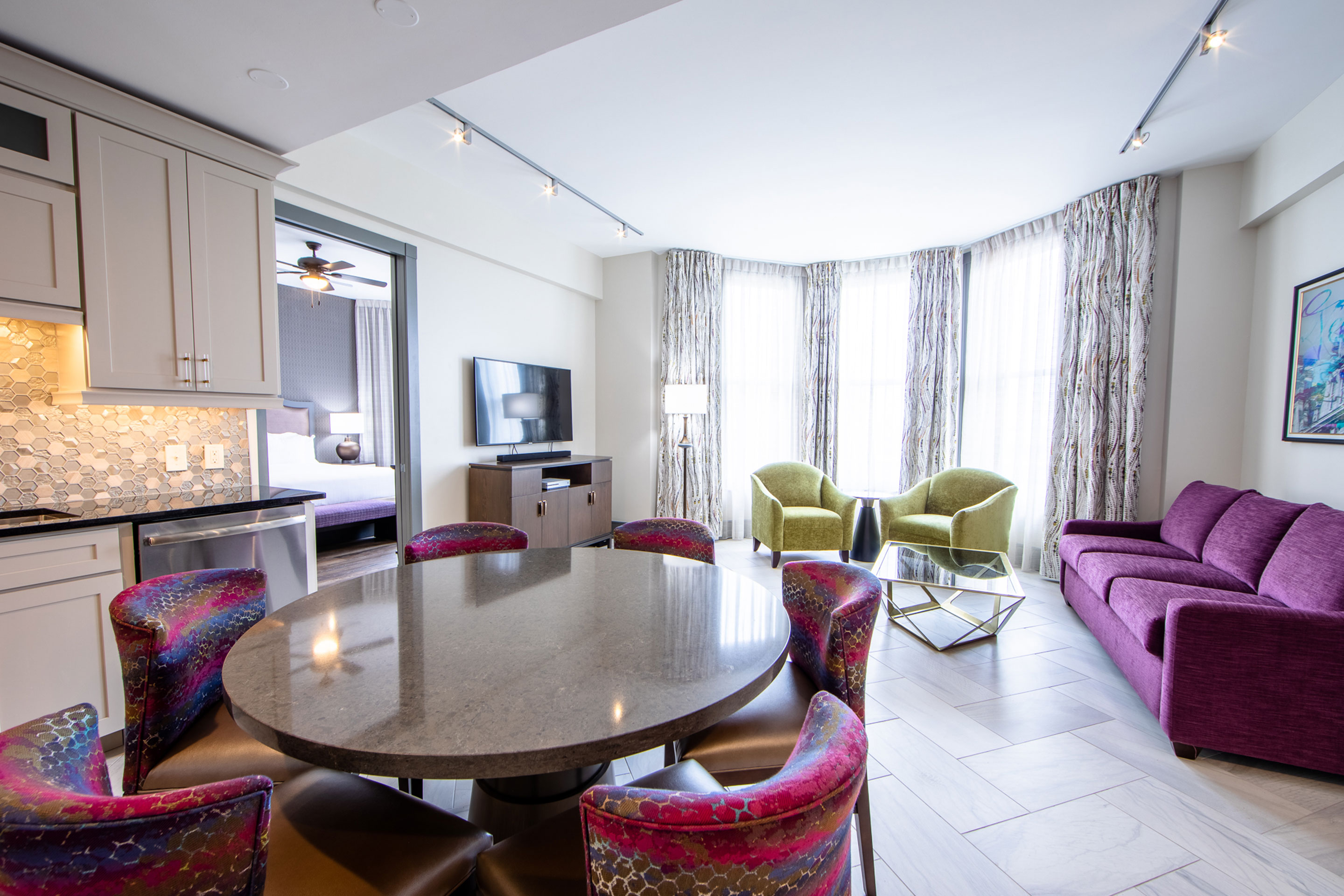 An interior shot of our villa with green and purple furnishings in our New Orleans resort located in Louisiana.