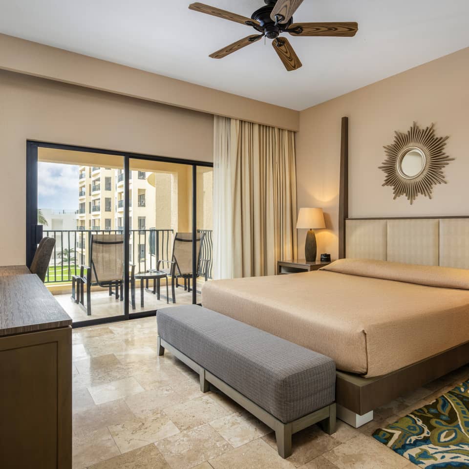 Peaceful master bedroom with ocean views and modern décor.