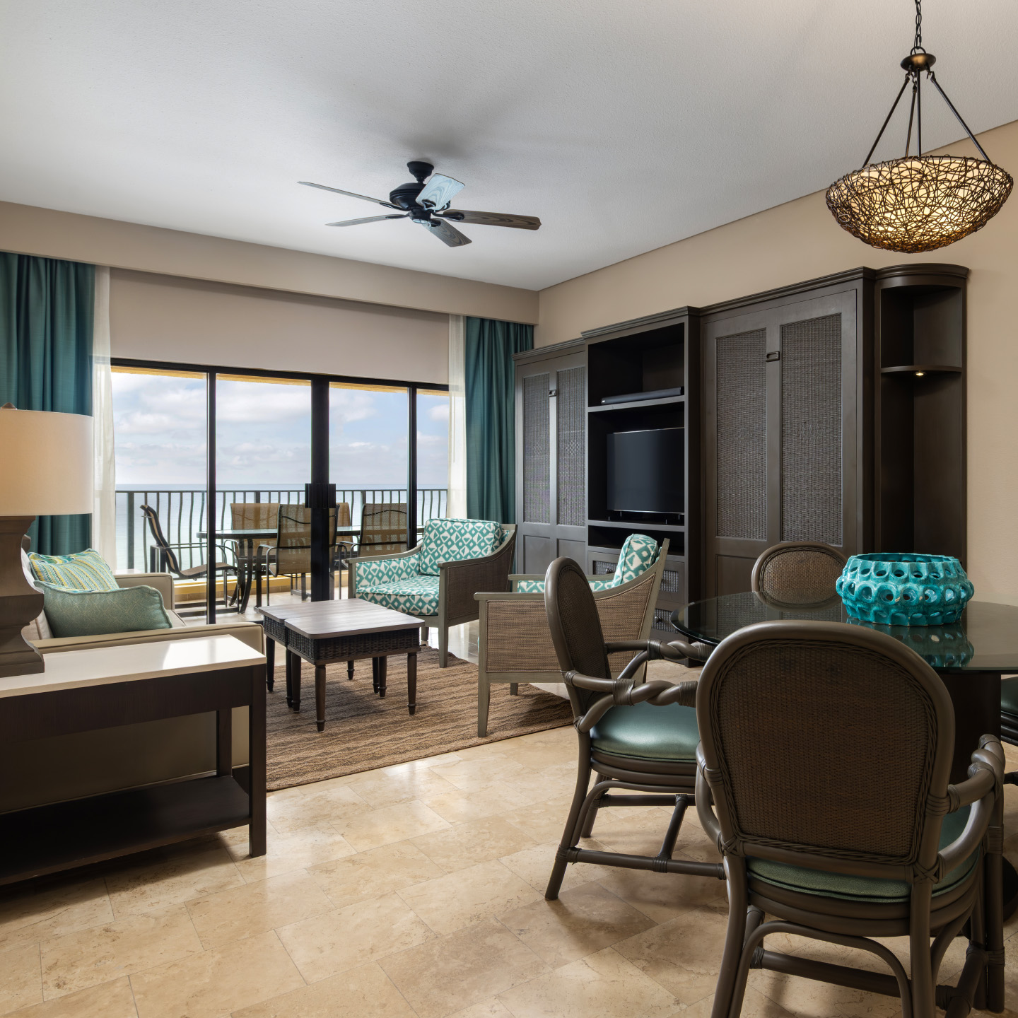 Spacious living room with seating and coastal décor.