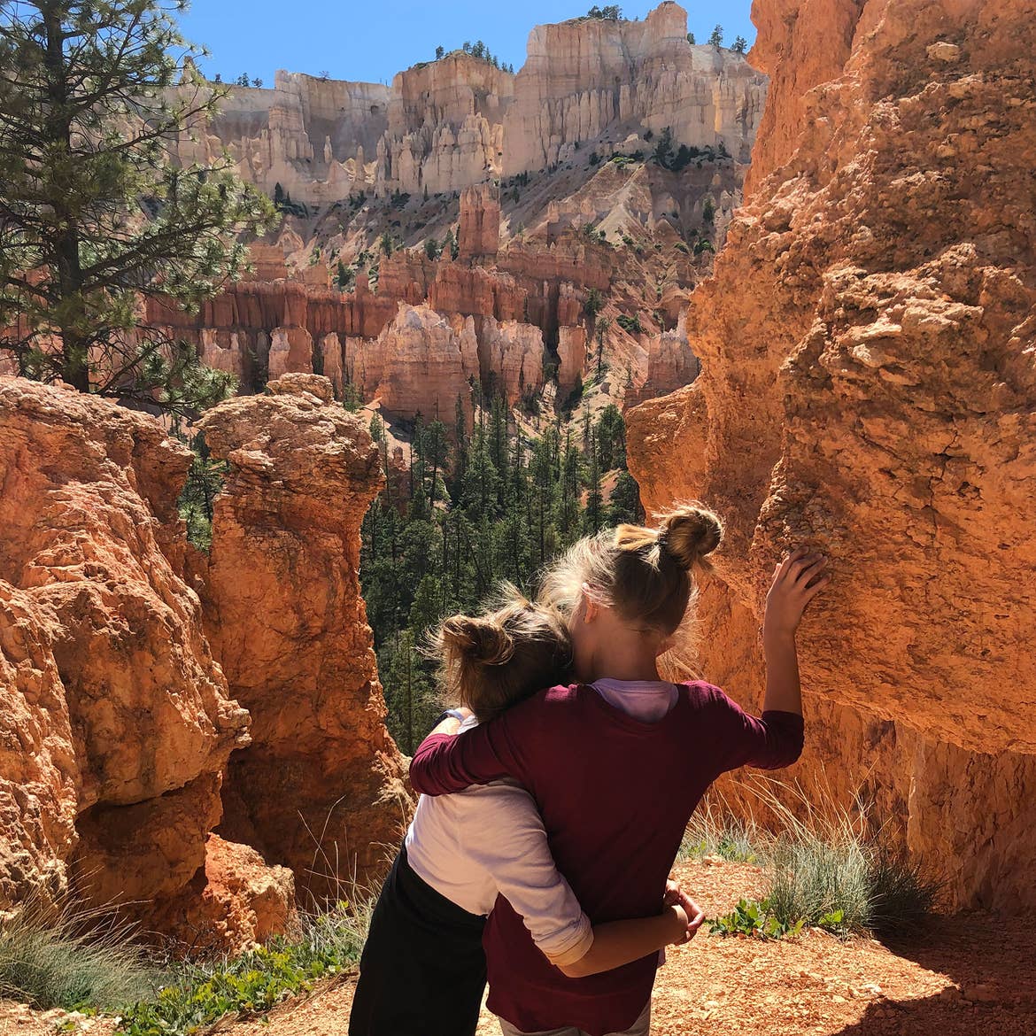 Kyler (left) and Kyndall (right) pose in front of Red Rock formations from Capitol Reef National Park.