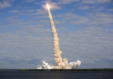 A trail of clouds from a rocket shooting into the atmosphere