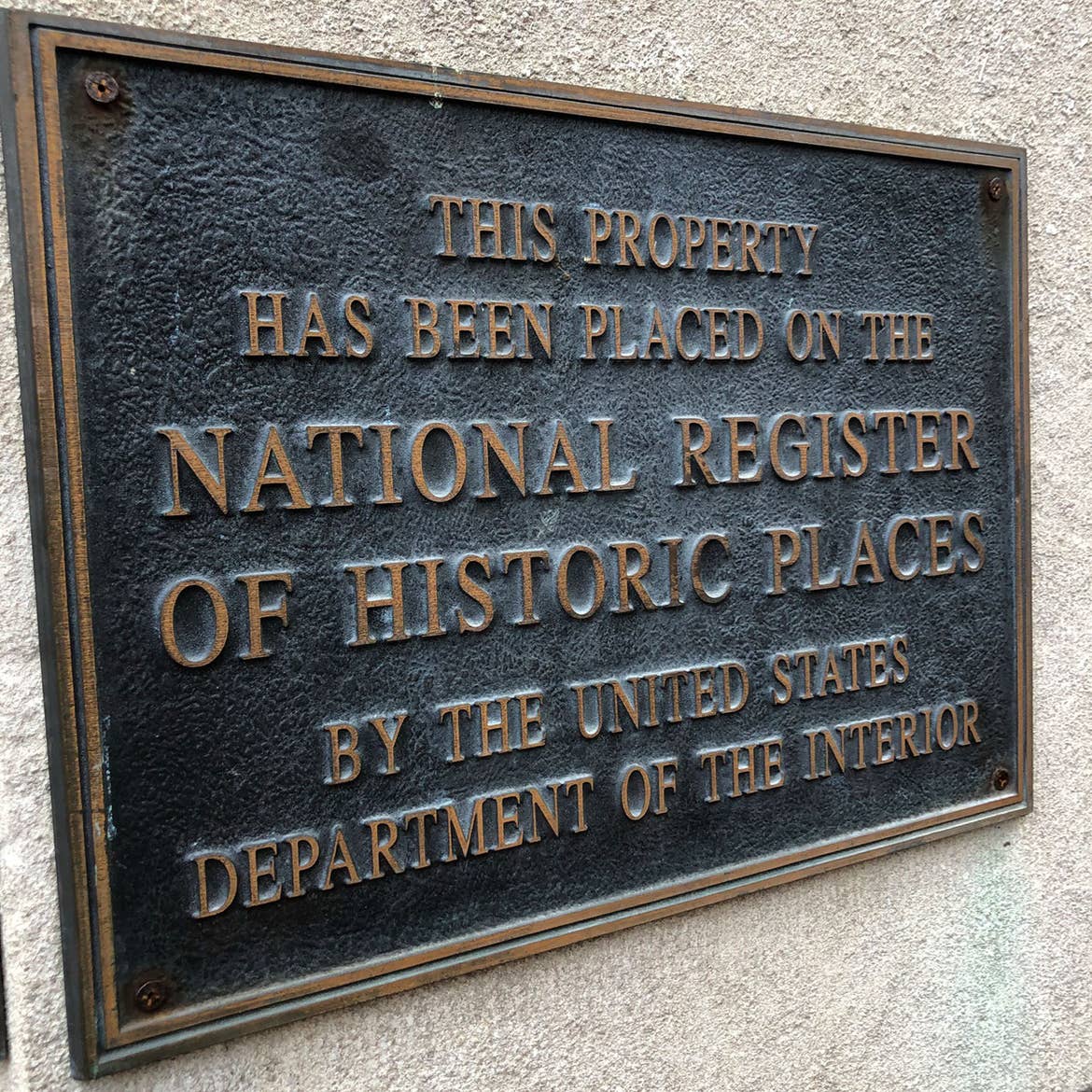 A plaque on the exterior of our New Orleans Resort in Louisiana. It read, 'This property has been placed on the National Register of Historic Places by the United States Department of the Interior.'