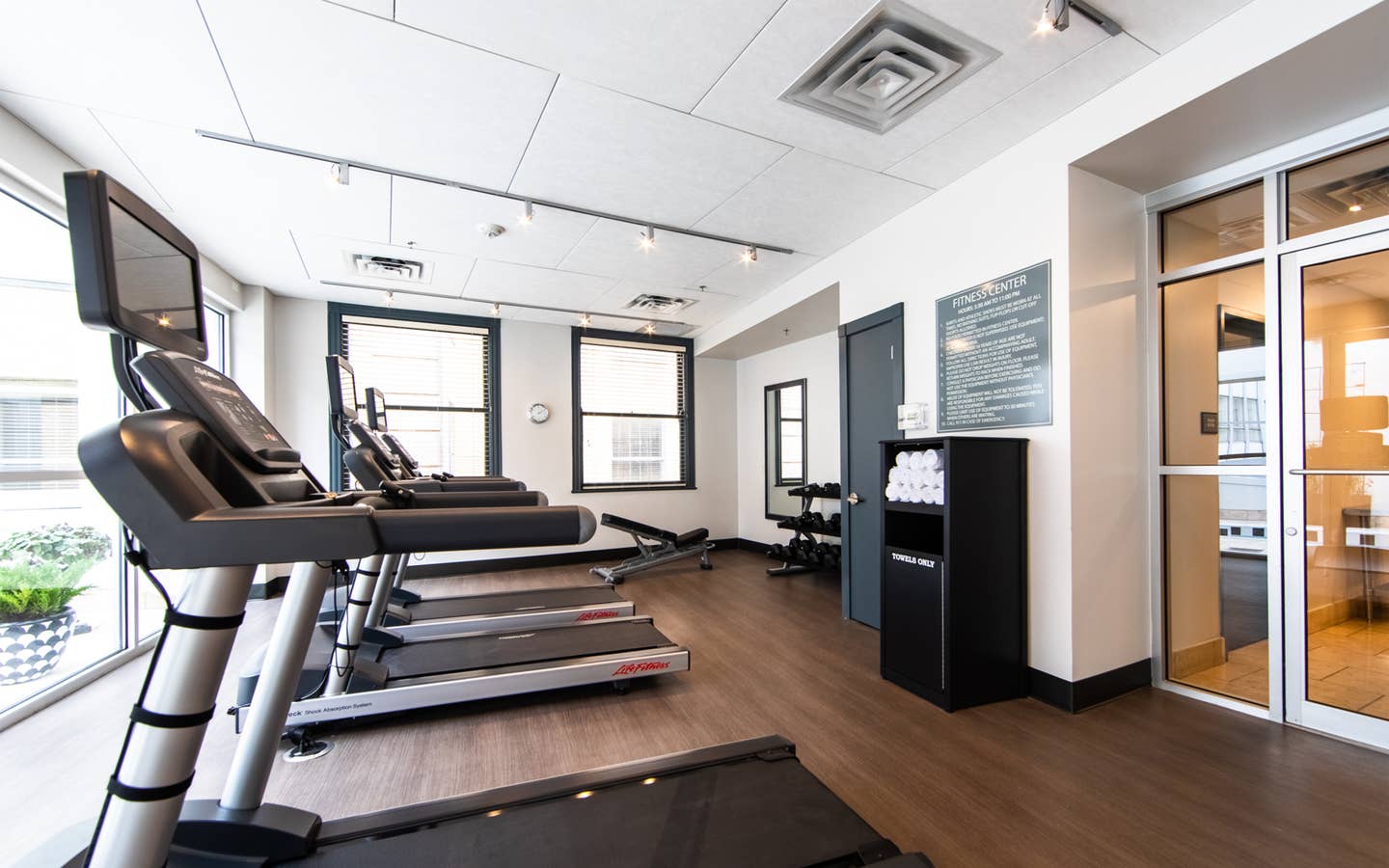 Fitness center with treadmills and free weights at New Orleans Resort in Louisiana.