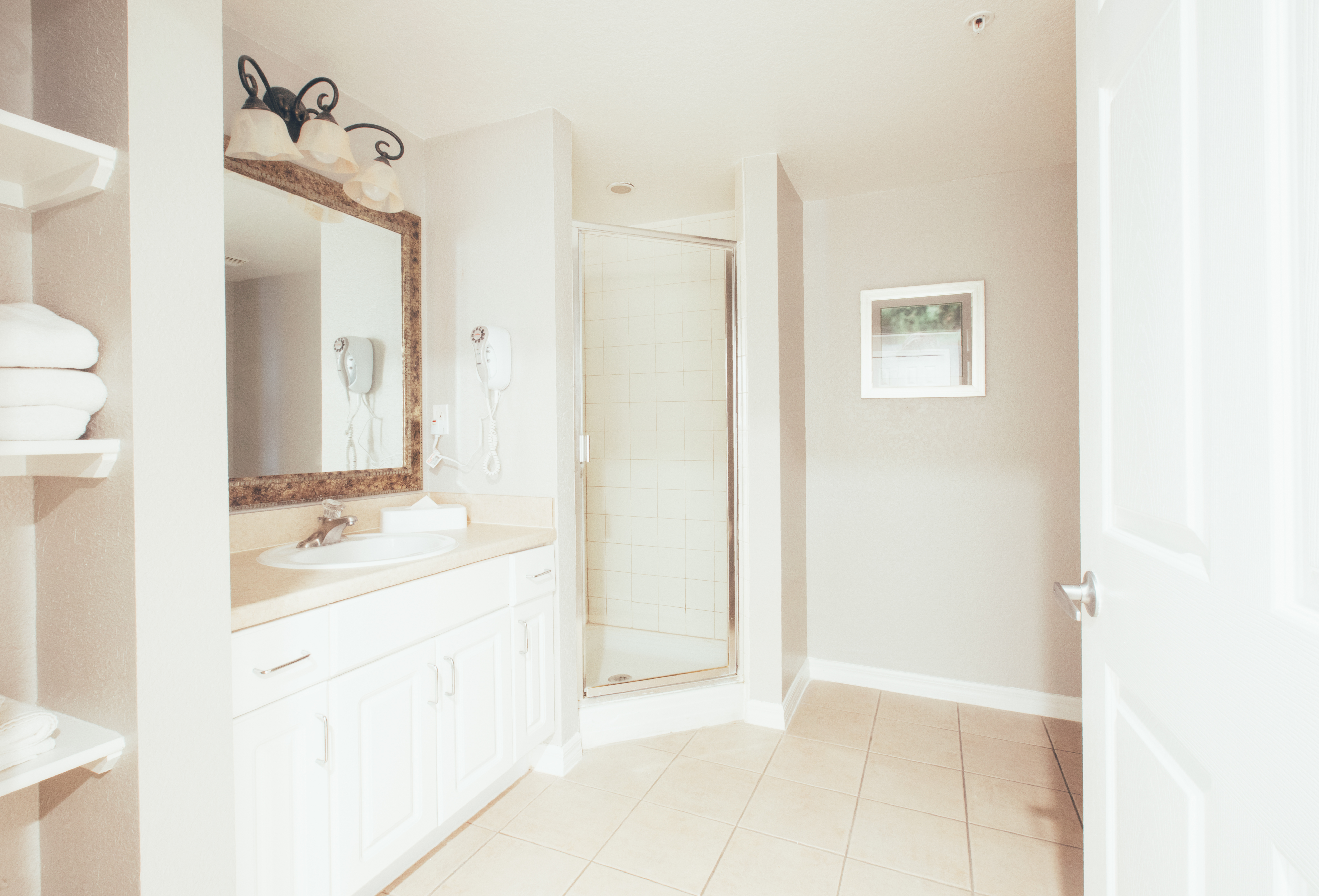 Full bathroom with walk-in shower in a villa in River Island at Orange Lake Resort near Orlando, Florida