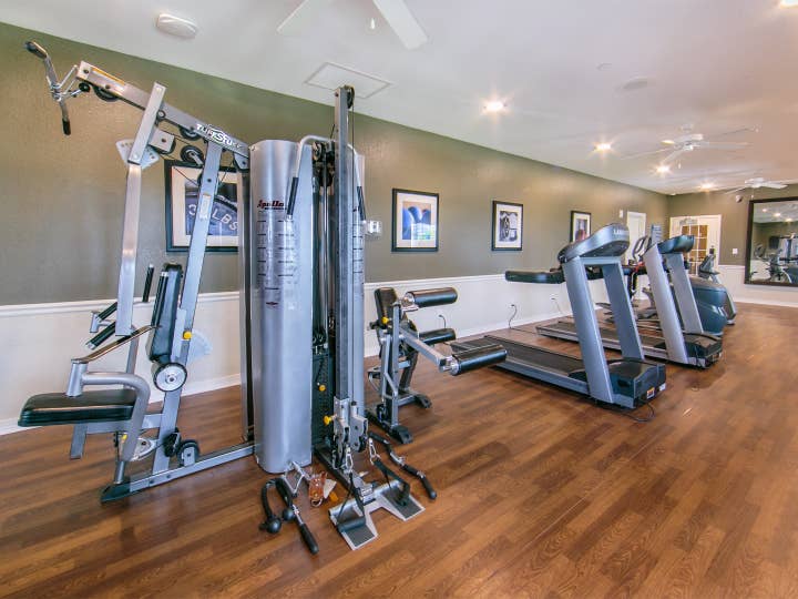 Fitness center with weights and treadmills at Orlando Breeze Resort near Orlando, Florida.