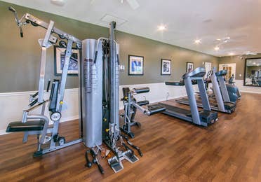 Fitness center with weights and treadmills at Orlando Breeze Resort near Orlando, Florida.