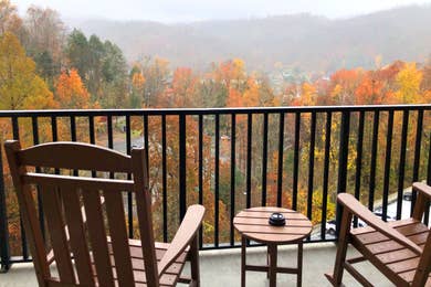 The two rocking chairs on the balcony of our two-bedroom villa at Smoky Mountain Resort overlooking the fall foliage.