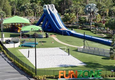 Fun Zone at Orange Lake Resort in Orlando, FL showing an inflatable slide and beach volleyball court.