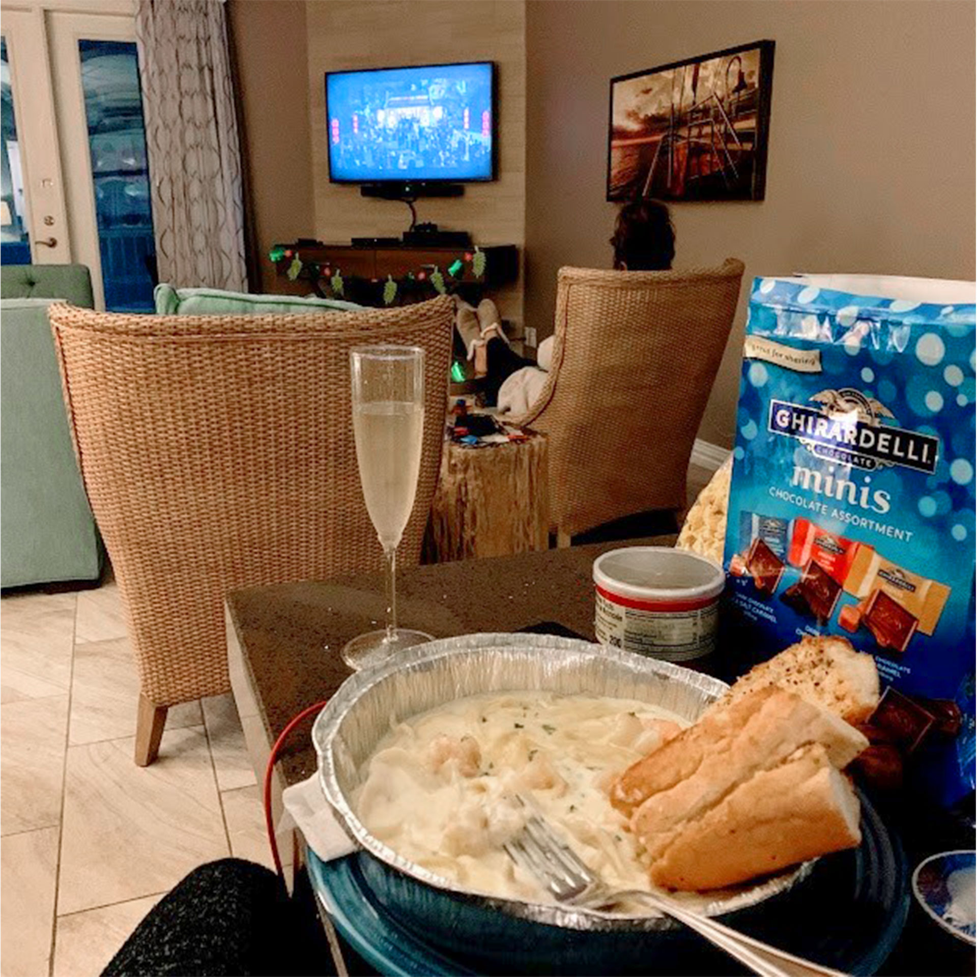 Champagne, chocolates and pasta placed on a table inside the villa of our Galveston Beach Resort in Galveston, Tx.