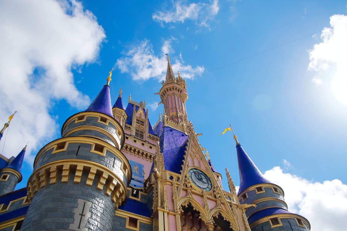 Cinderella Castle under a blue and cloudy sky at the Magic Kingdom Park only at Walt Disney World® Resort.