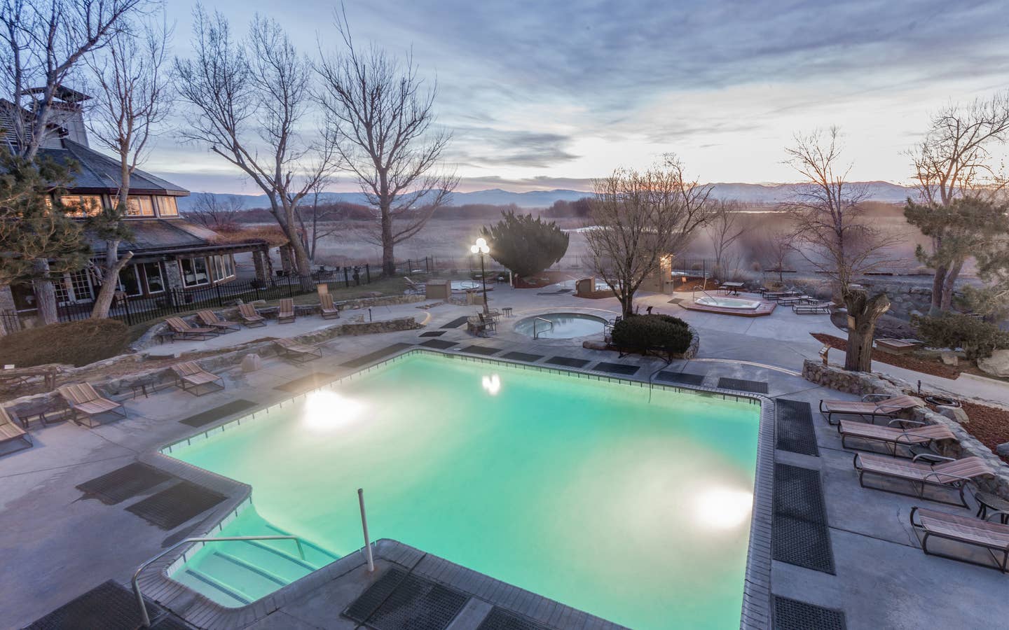 Outdoor pool with view of Sierra Nevada Mountains at David Walley's Resort in Genoa, Nevada.