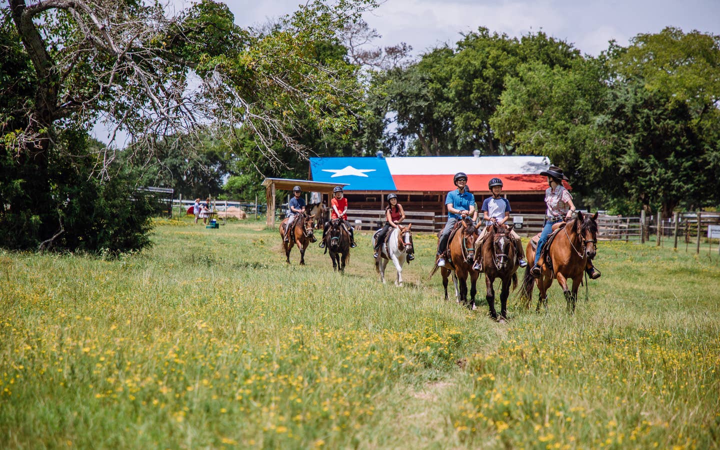 Guests riding horses at Villages Resort in Flint, Texas.