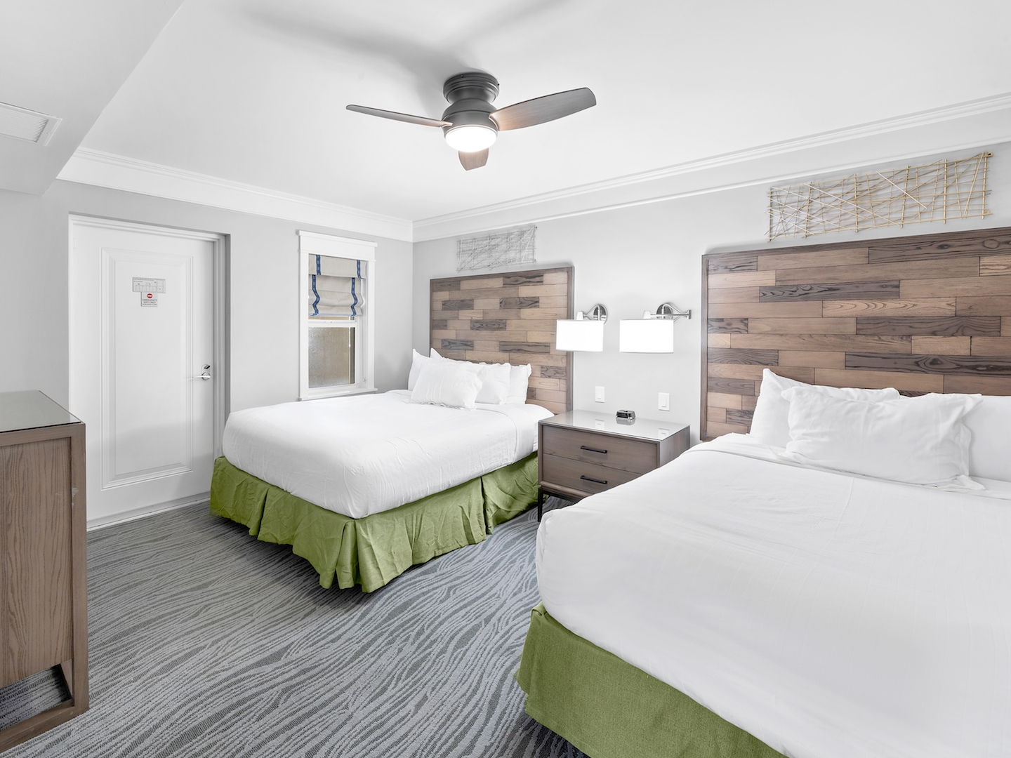 Two beds in a bedroom in a four-bedroom Signature Collection villa at Cape Canaveral Resort.