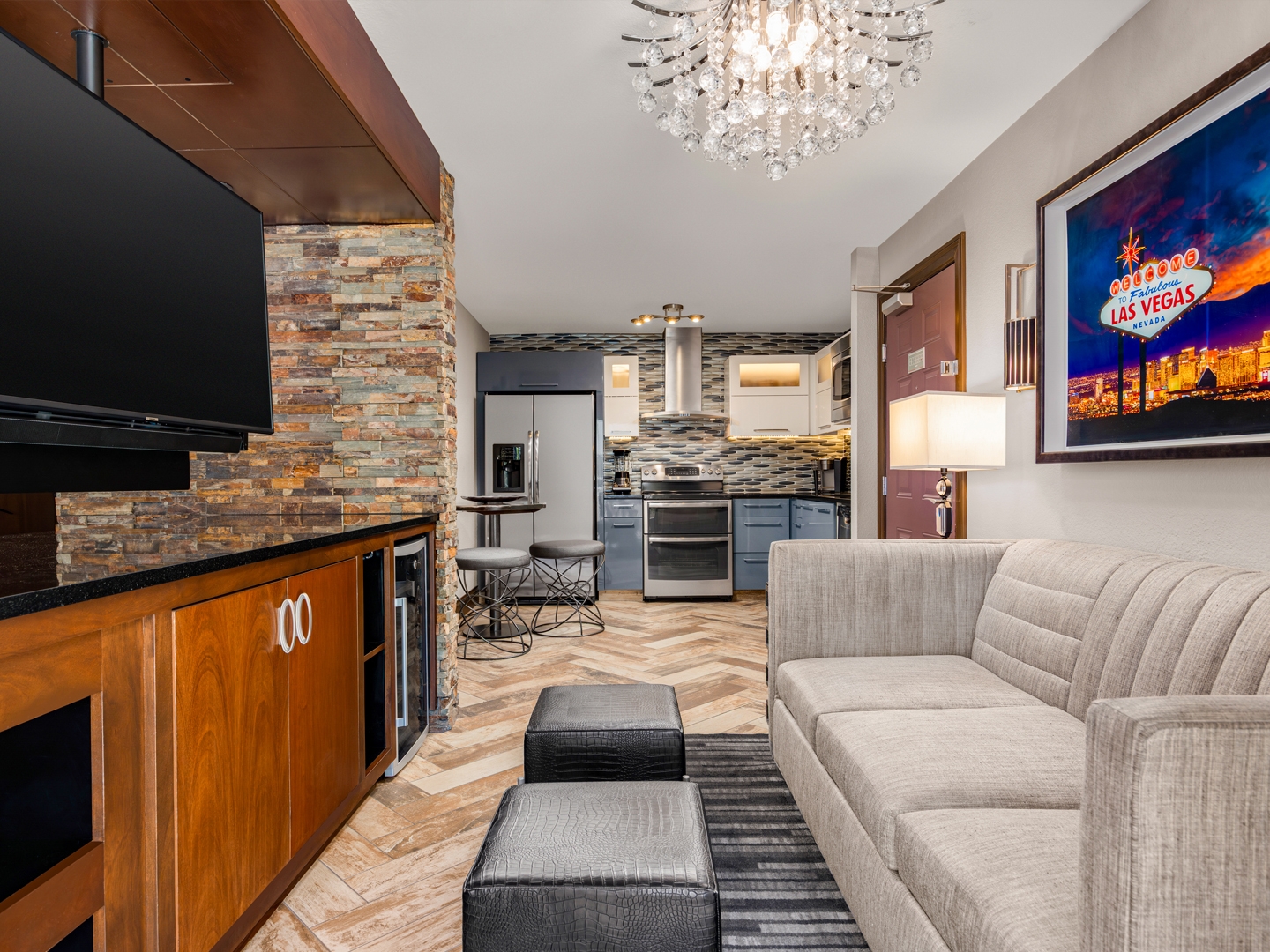 Suite living area with full kitchen and contemporary design.
