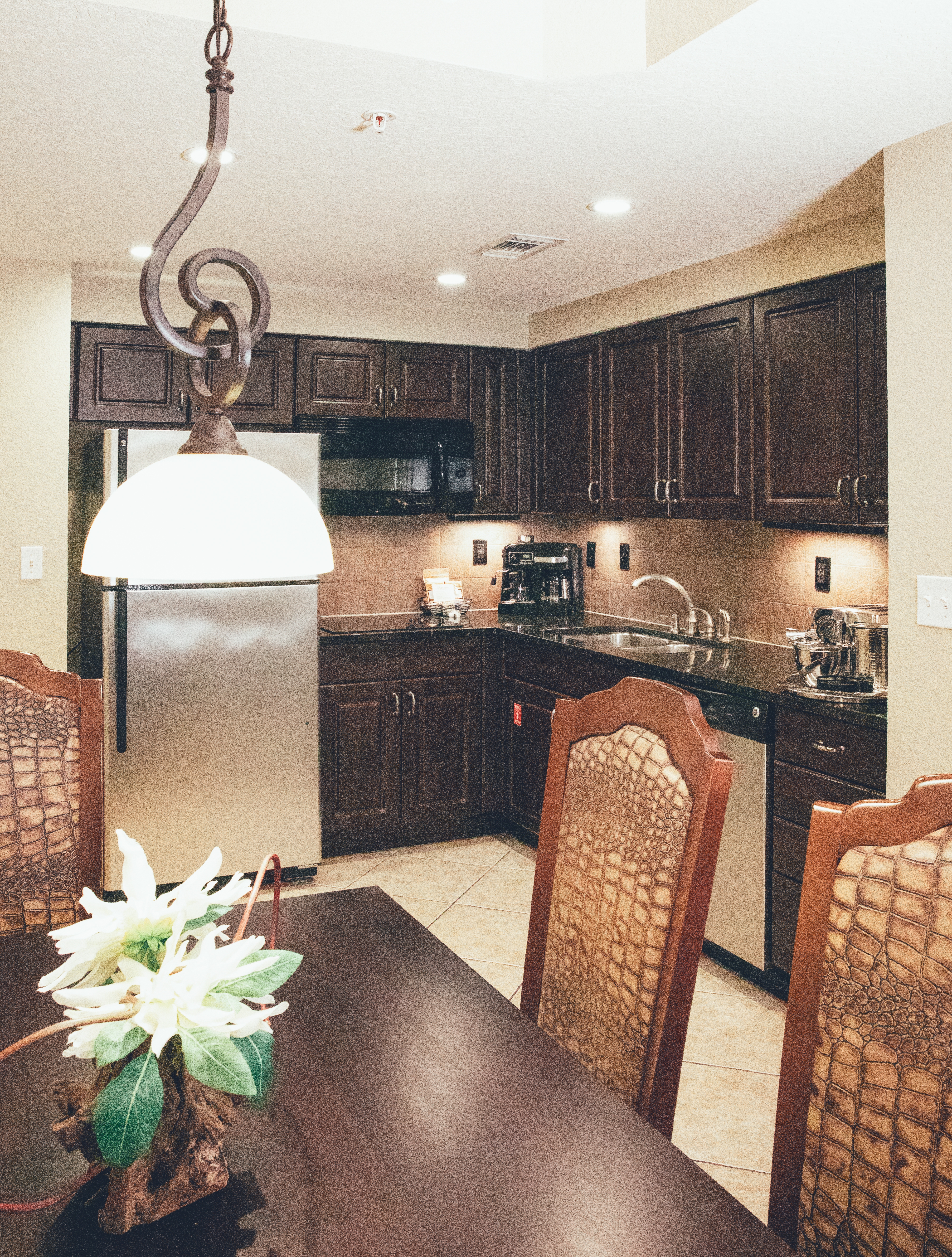 Full kitchen with stainless steel appliances in a Signature villa in River Island at Orange Lake Resort near Orlando, Florida