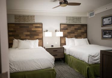 Bedroom with two beds in a two-bedroom Signature Collection villa at Cape Canaveral Beach Resort.