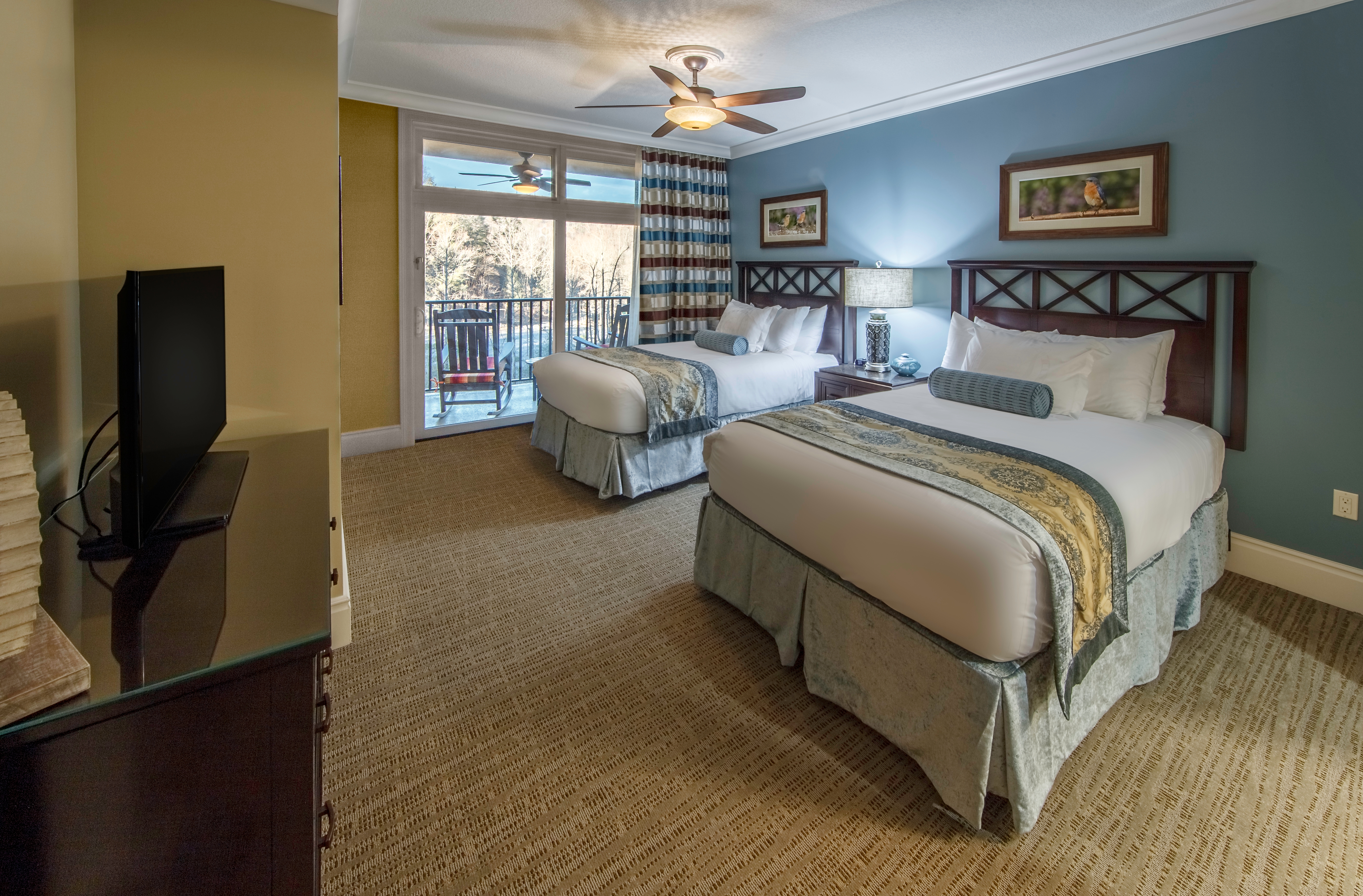Bedroom with two beds in a villa at Smoky Mountain Resort in Gatlinburg, Tennessee.